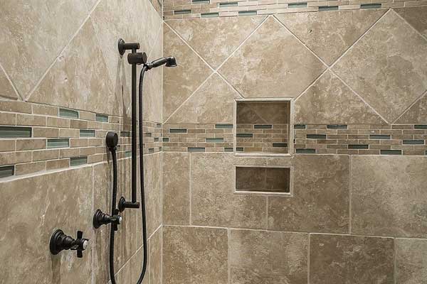 walk in shower room with beige tiled walls